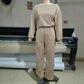 Av skulder jumpsuit med V-rygg og elastisk midje